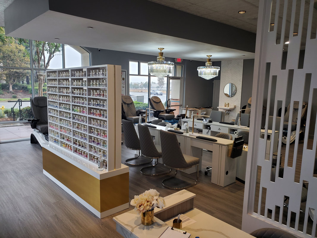 Elegant and modern nail salon interior designed by AtoZ Construction, featuring a well-organized polish display, stylish decor, and comfortable seating for customers.Picture