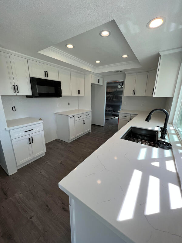 Spacious and modern kitchen designed by AtoZ Construction, featuring sleek cabinetry, high-end appliances, and ample counter space.Picture